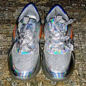 These iridescent shoes size 7 in woman’s have never been worn only tried on.